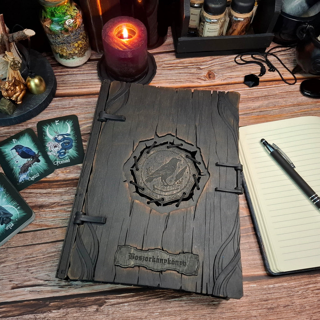 Handcrafted wooden raven grimoire box with Hungarian “Boszorkánykönyv” title