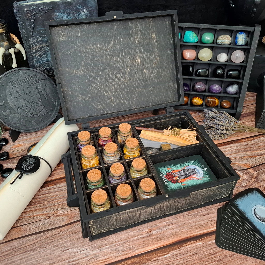Handcrafted Celtic ritual storage box with neatly organized herbs, glass bottles, tarot cards, and ritual tools, creating a calm and beautifully ordered magical space.
