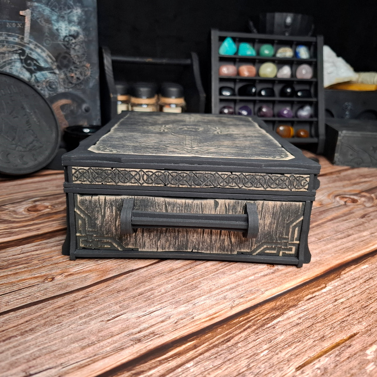 Side view of a handcrafted Celtic ritual storage box featuring carved Celtic knotwork and a solid wooden handle. Designed for storing crystals, herbs, tarot accessories, and ritual tools.
