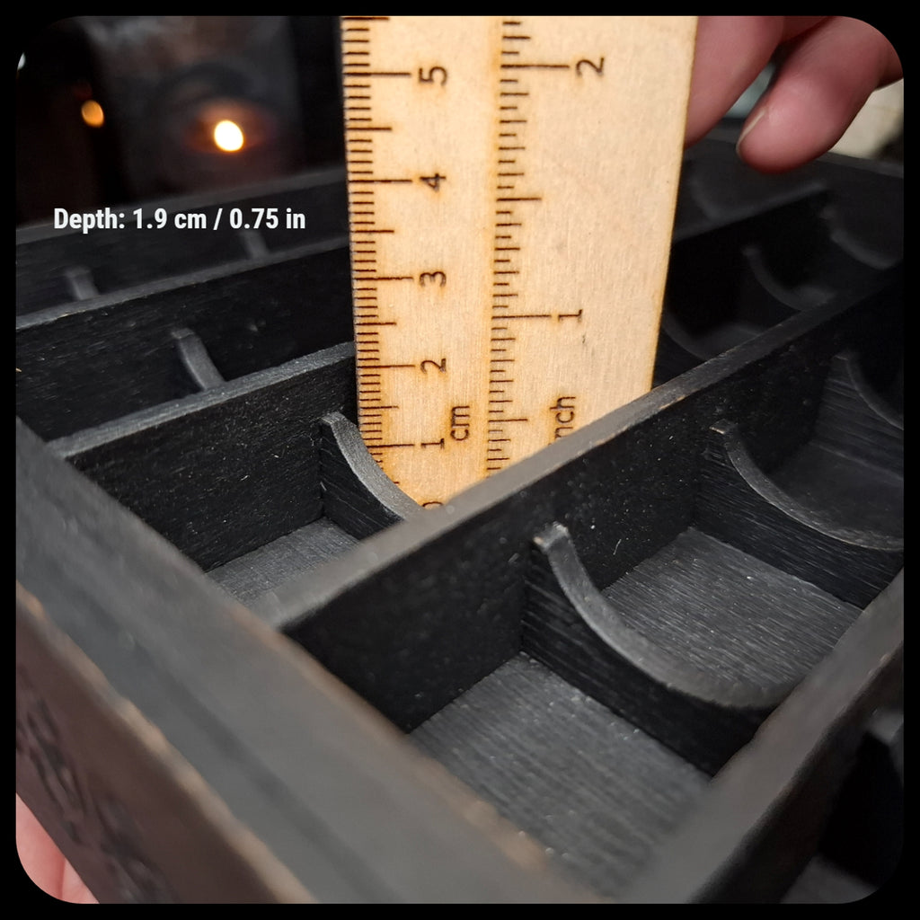 Measurement of the compartment depth inside the wooden crystal storage shelf.
