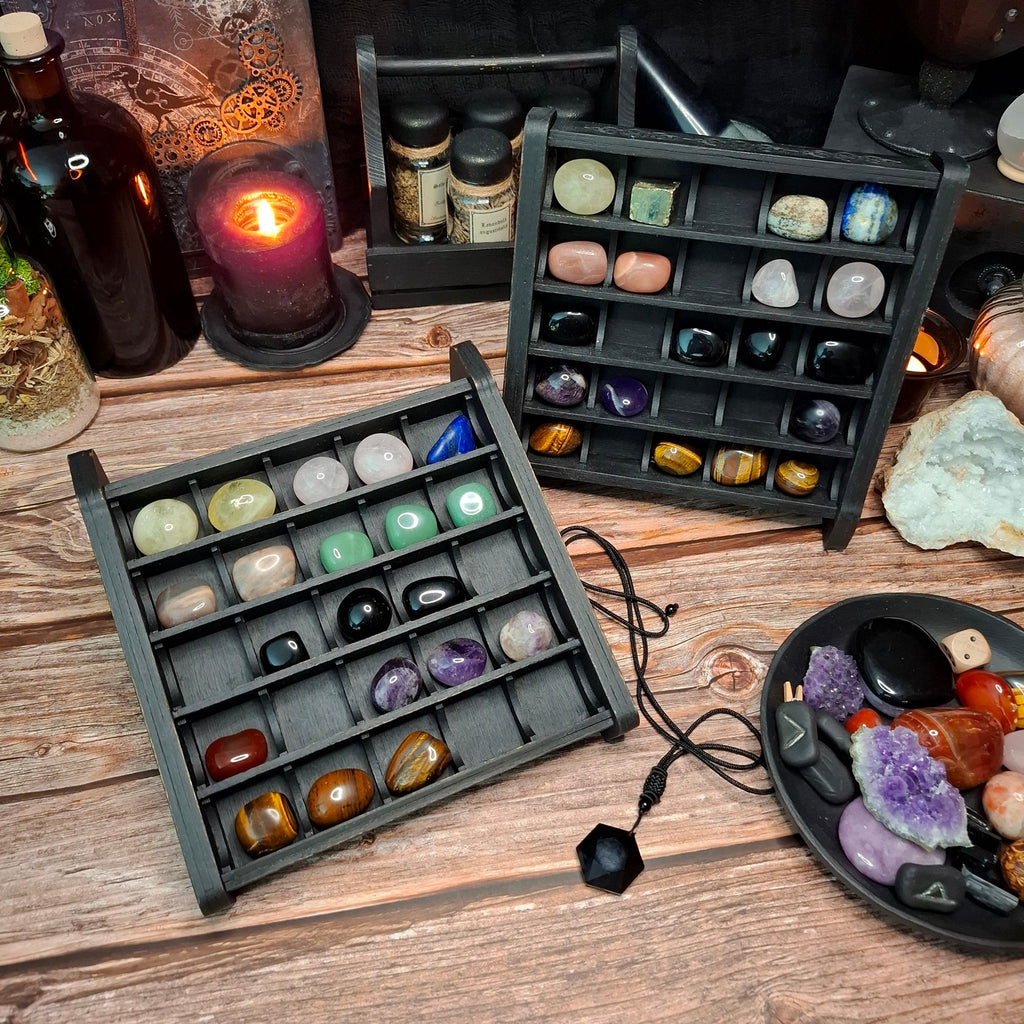Wooden crystal storage shelves displaying a colorful collection of gemstones and crystals.
