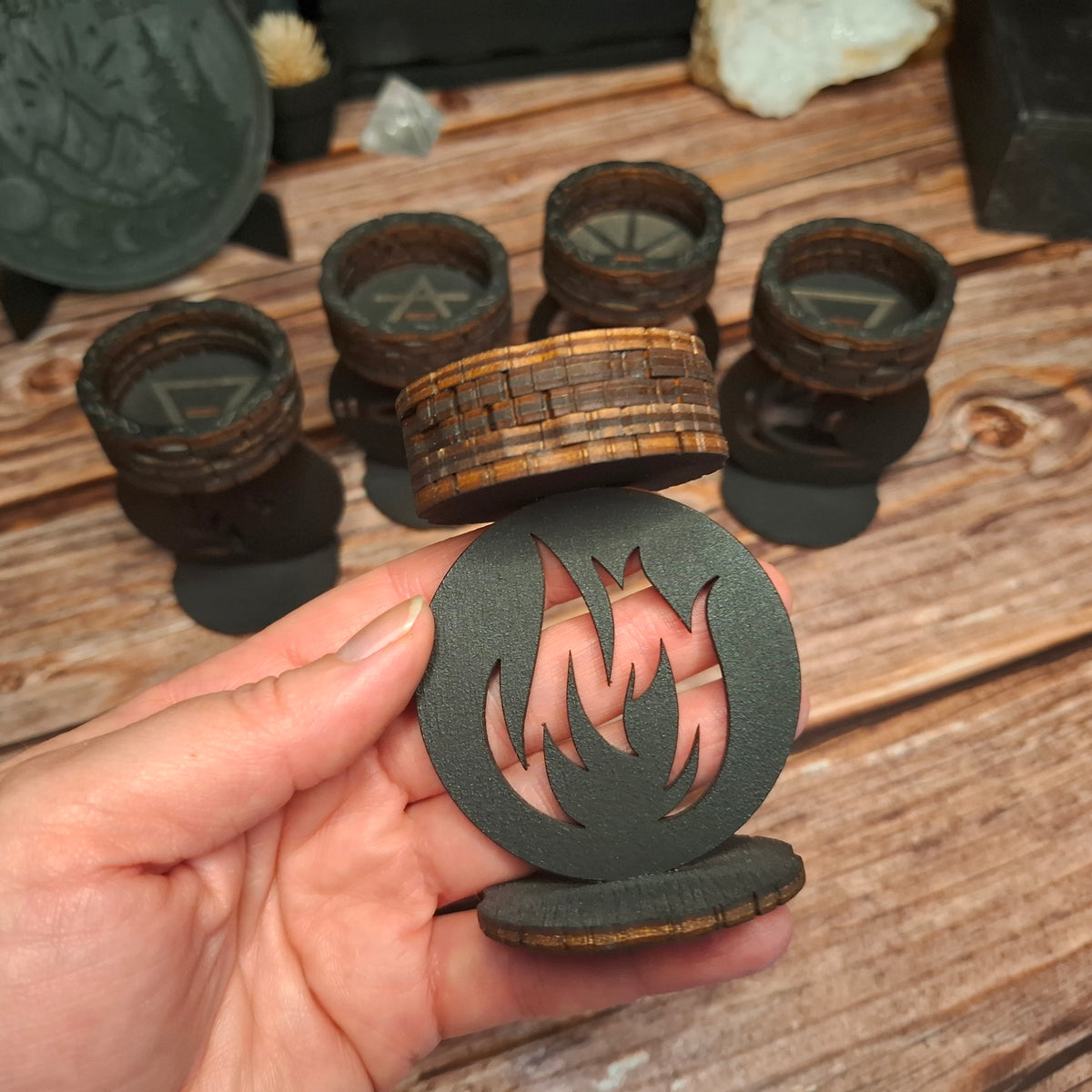 Handmade wooden fire element tea light candle holder shown in hand