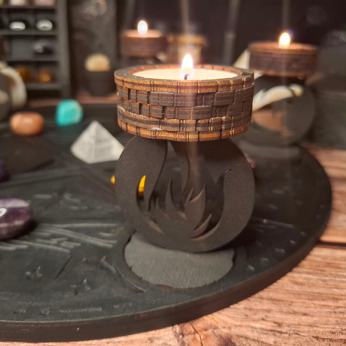 Close-up of a lit handmade wooden ritual candle holder in a mystical setting