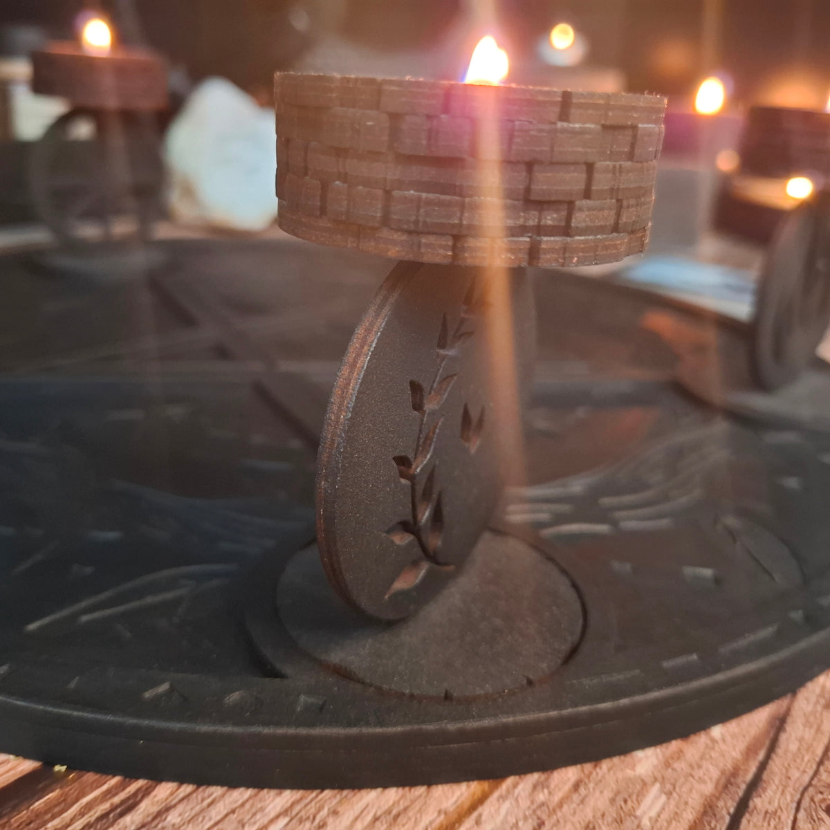 Handmade wooden ritual tea light candle holder with a lit candle