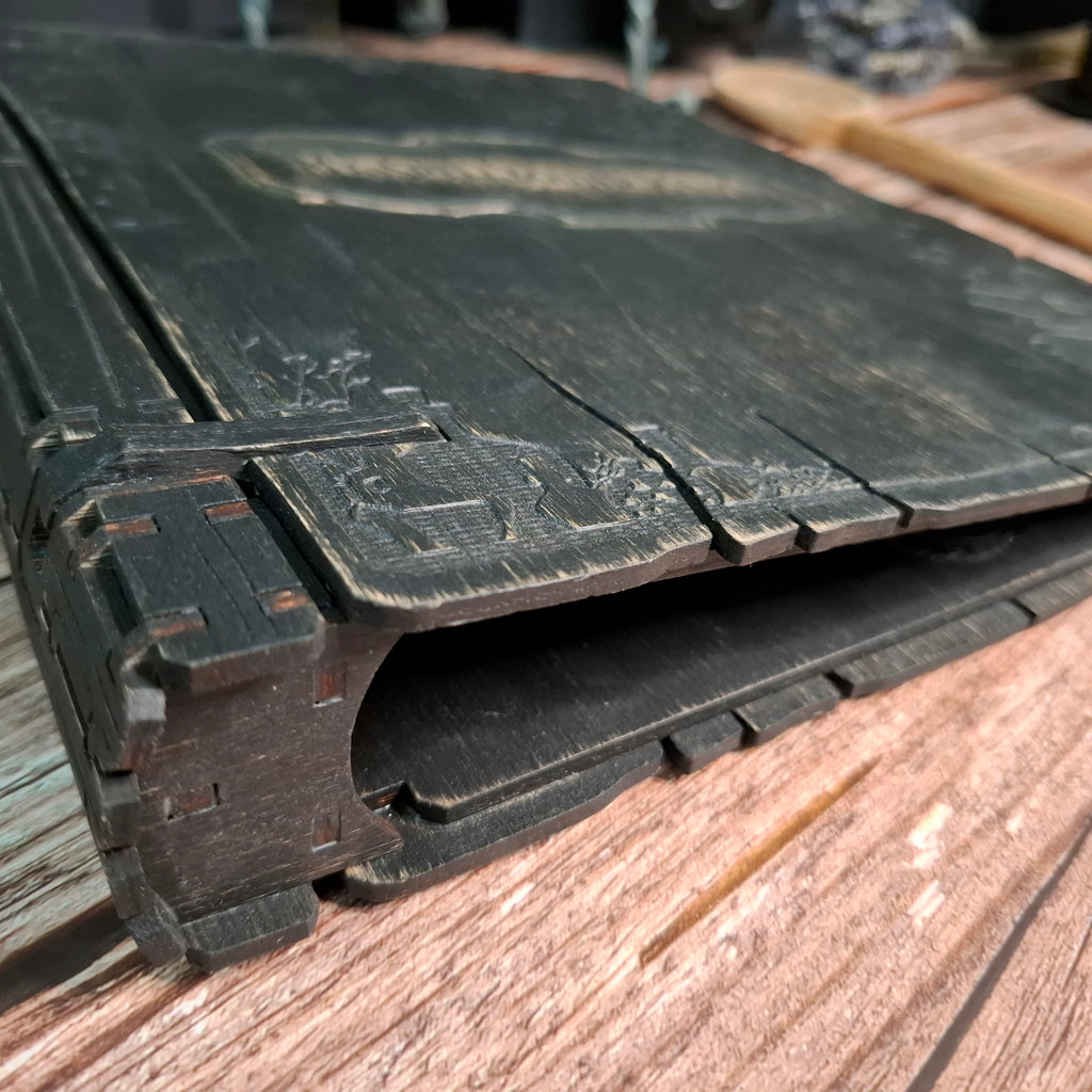 Book-style edge detail on a handcrafted wooden recipe binder