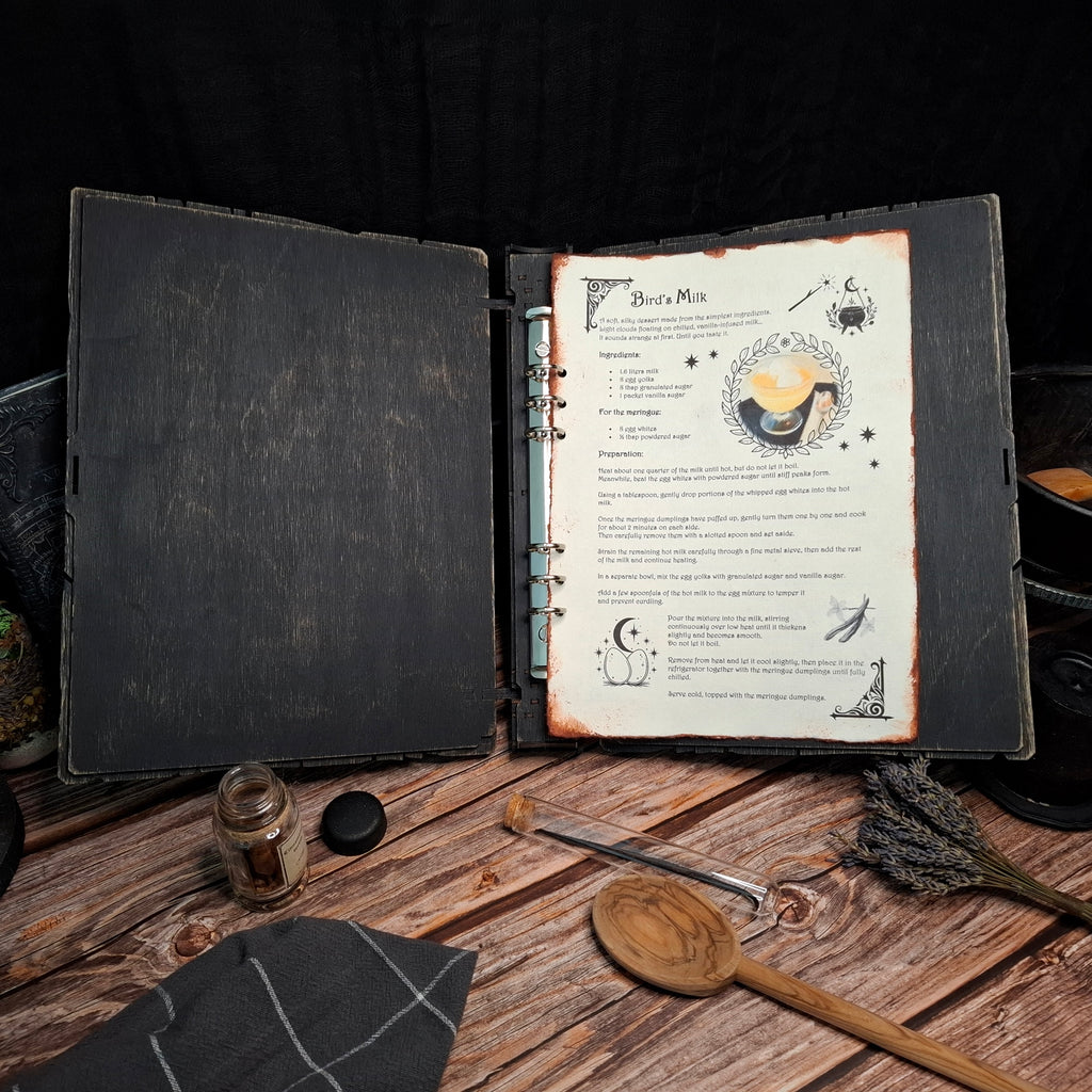 Open My Spellbound Recipes wooden binder displaying recipe pages inside