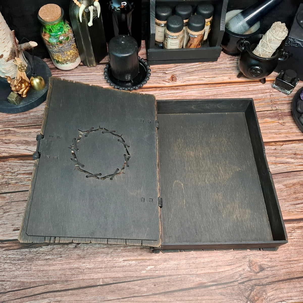 Open handmade raven grimoire box with inner storage space