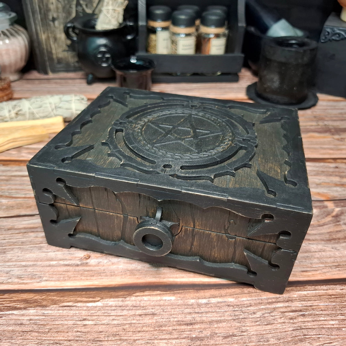 Front view of a handmade wooden pentagram ritual box with decorative drawer-style handle