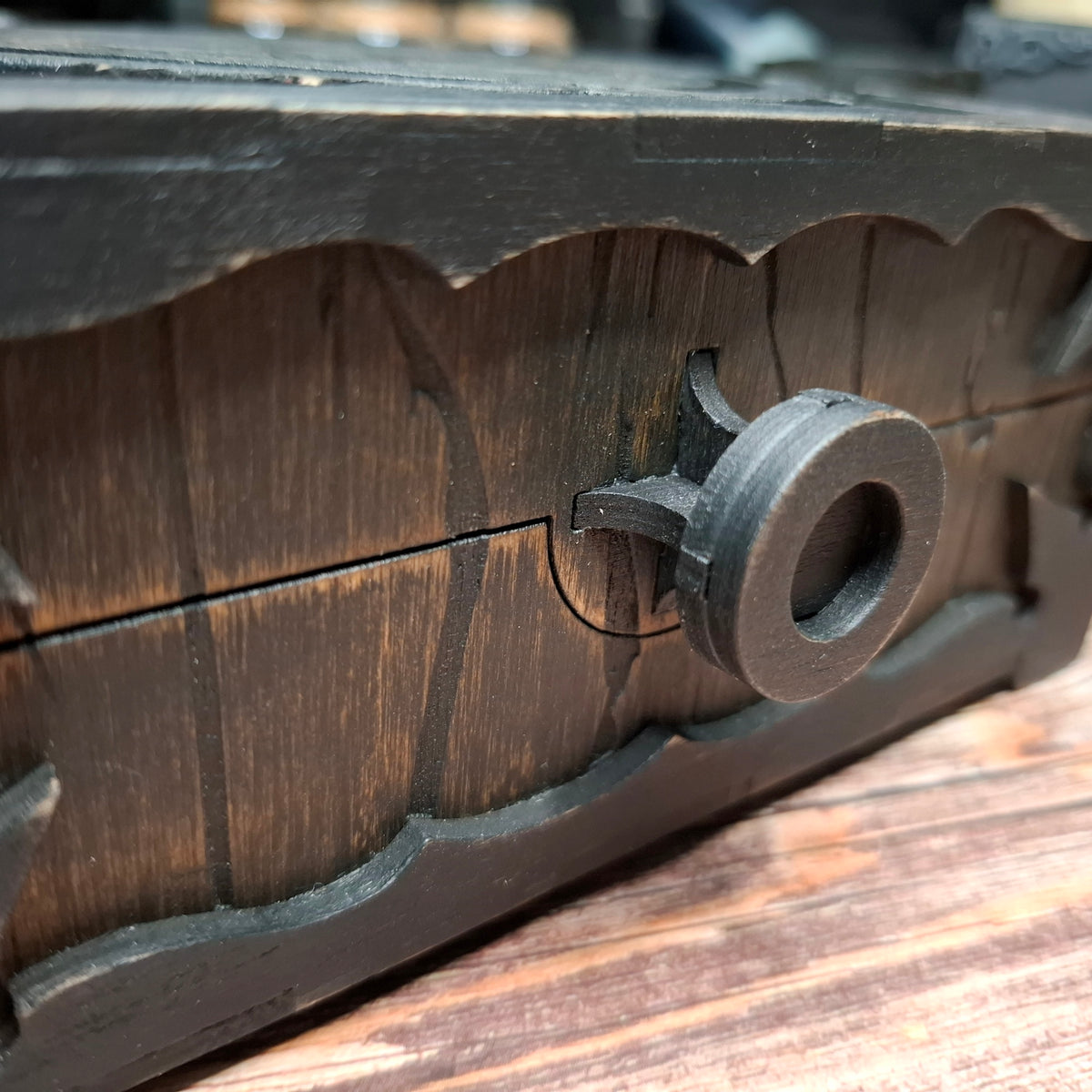 Close-up of the decorative wooden handle on a handmade pentagram ritual box