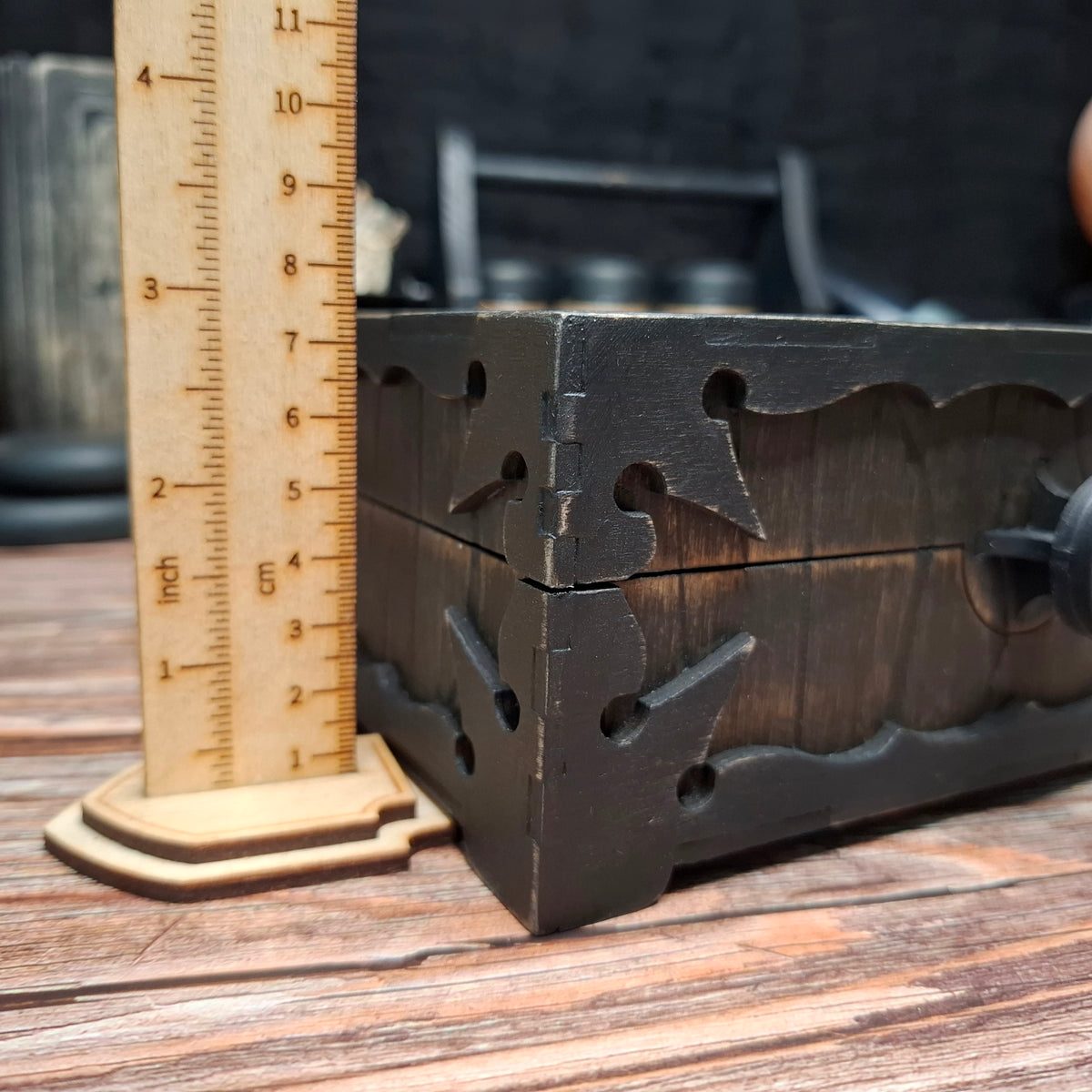 Side view of a handmade wooden pentagram ritual box with height measurement
