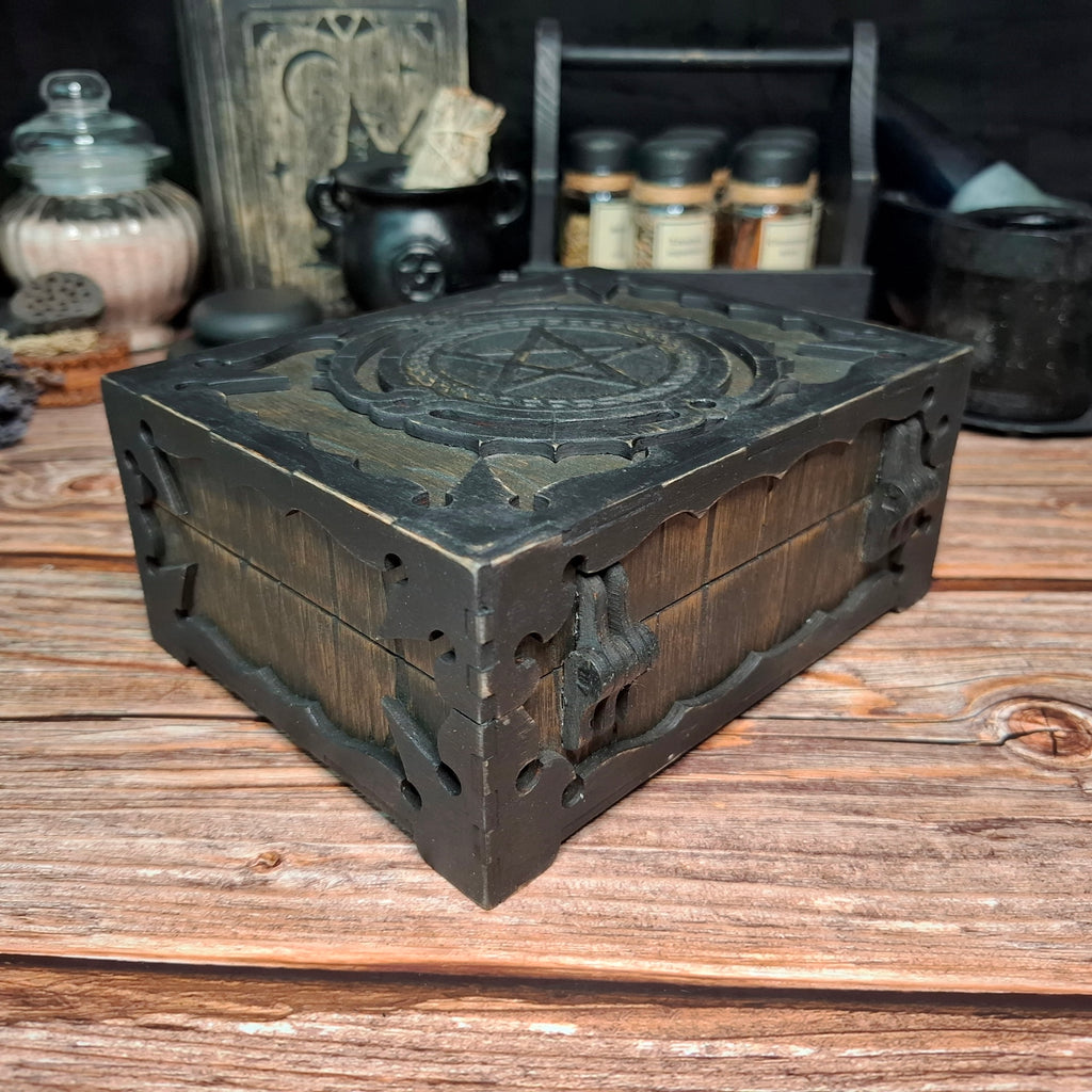 Handmade wooden pentagram ritual box showing carved side details and corner construction