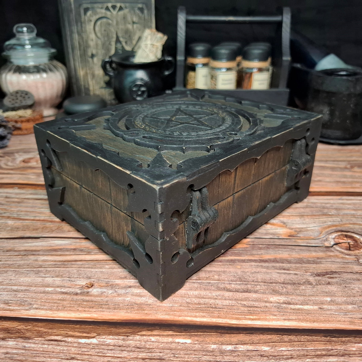 Handmade wooden pentagram ritual box showing carved side details and corner construction