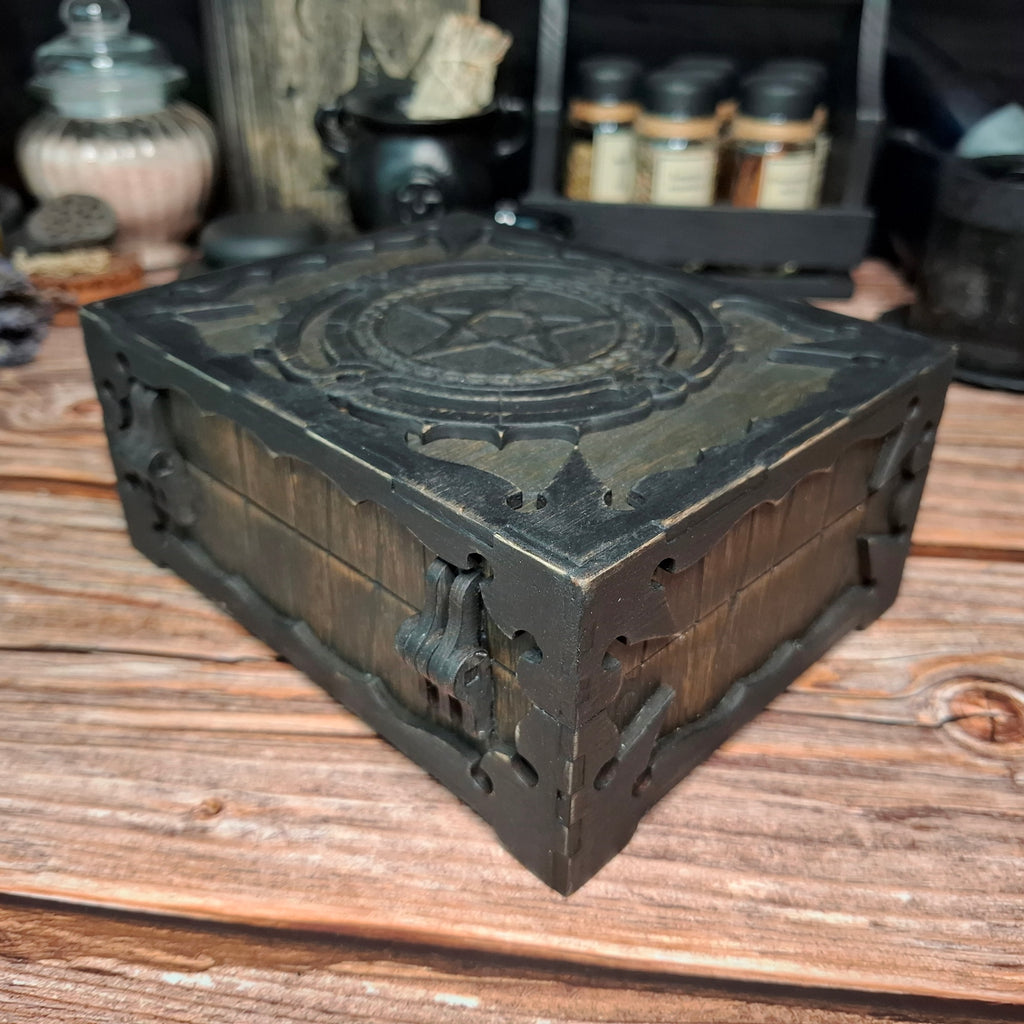 Right corner view of a handmade wooden pentagram ritual box with engraved decorative details
