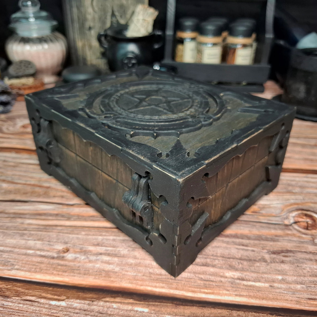 Right corner view of a handmade wooden pentagram ritual box with engraved decorative details