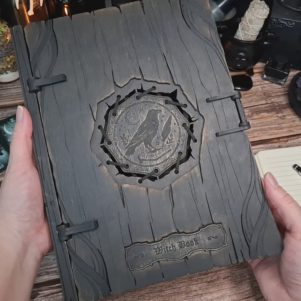 Handcrafted raven witch book box with engraved wooden cover and magnetic closure.