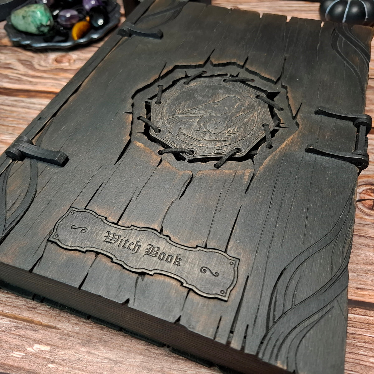Close-up detail of handmade raven witch book box cover