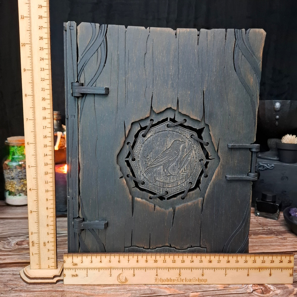 Handmade raven witch book box shown with ruler for size reference