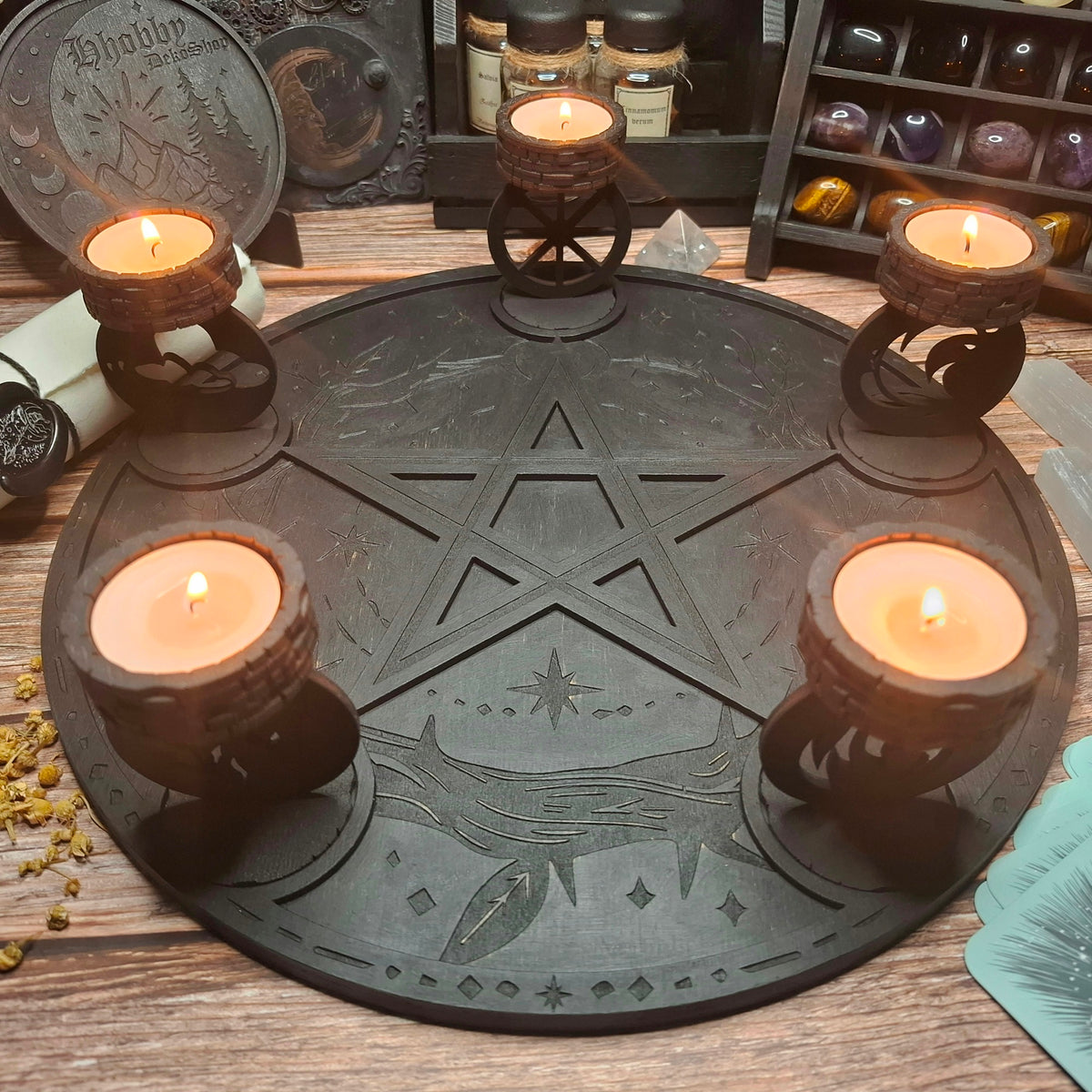 Handmade wooden ritual altar tray displayed with lit candles in a mystical atmosphere