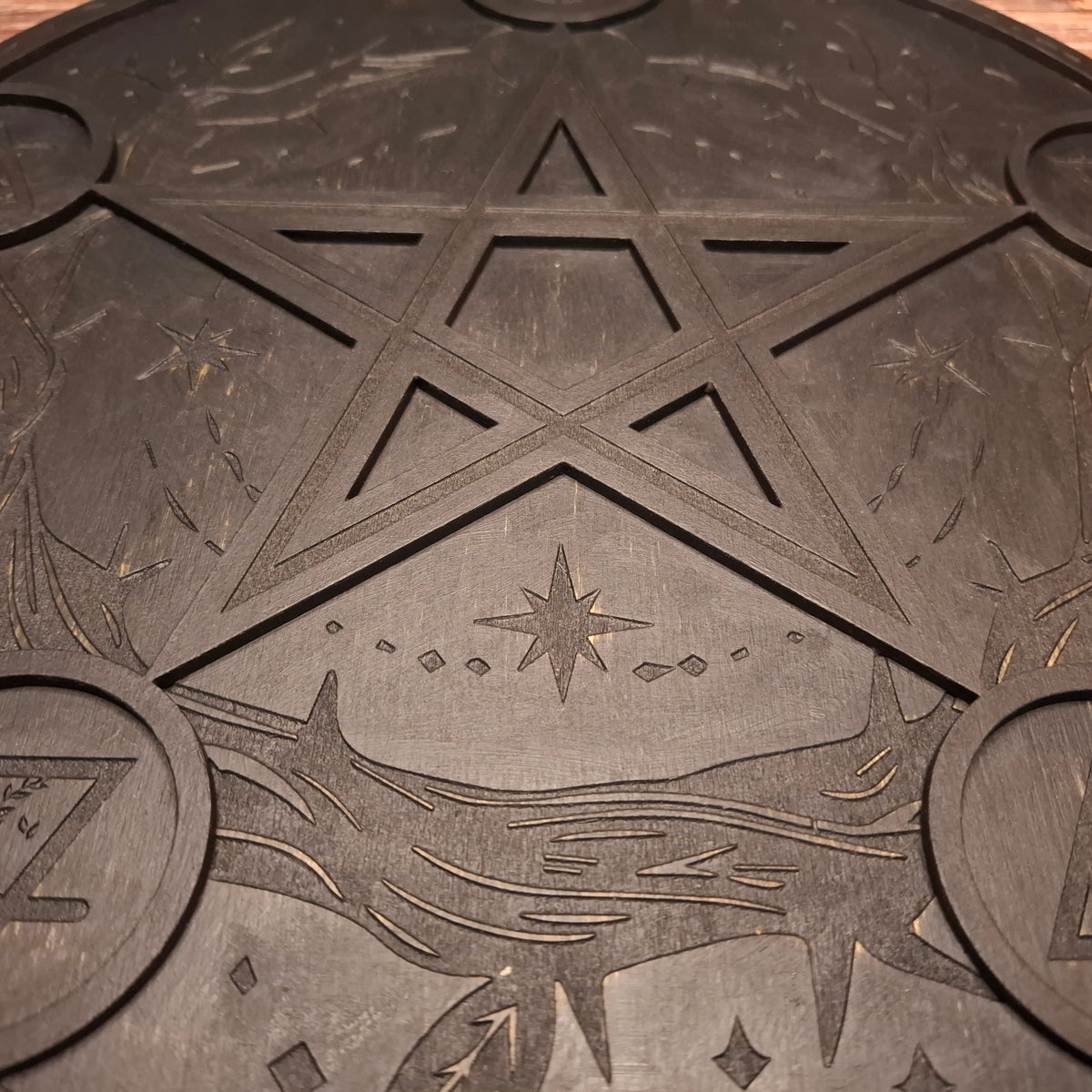 Close-up of engraved pentagram design on a handmade wooden ritual altar tray