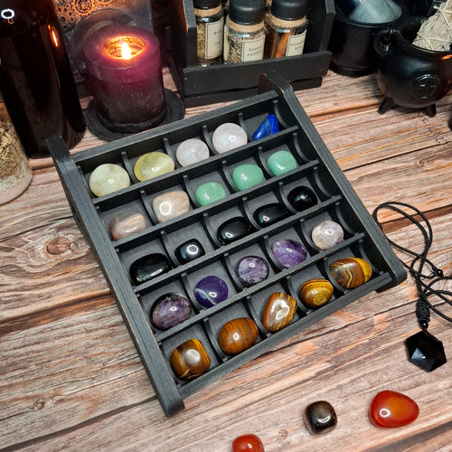Handcrafted wooden crystal storage box with a 5x5 compartment grid.
