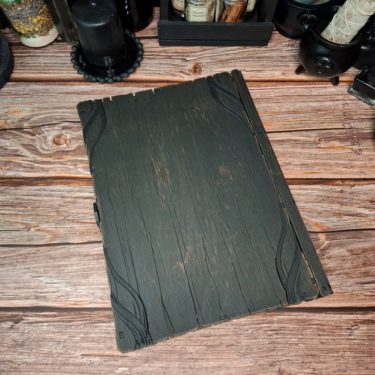 Back side of handcrafted wooden witch book storage box